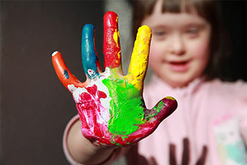 child with finger-paint and pre-existing condition for life insurance